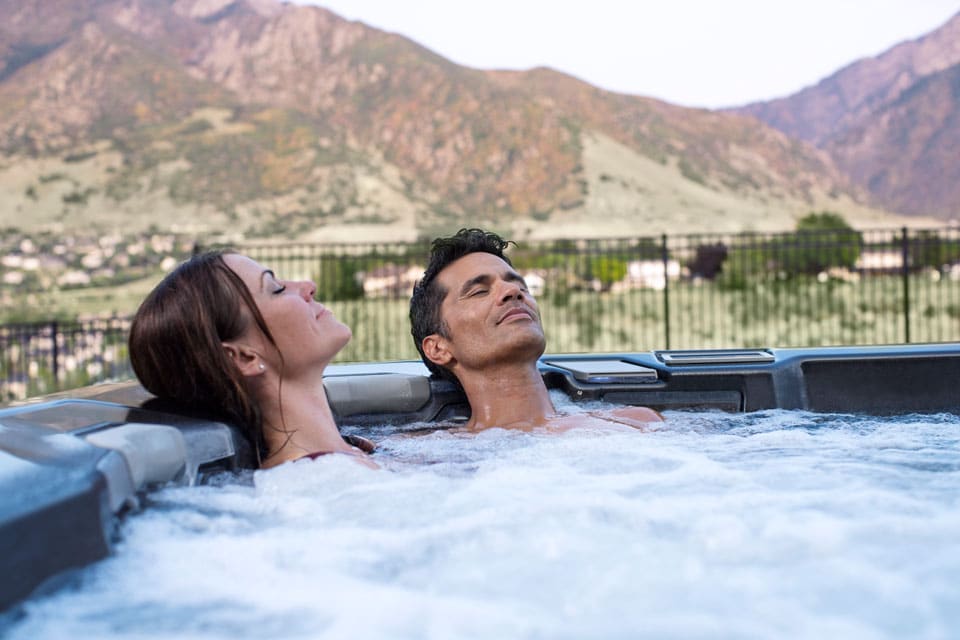 Couple relaxing in hot tub