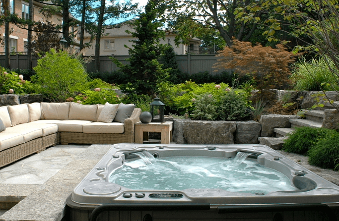 Sunken Backyard Lounge with a Hot Tub