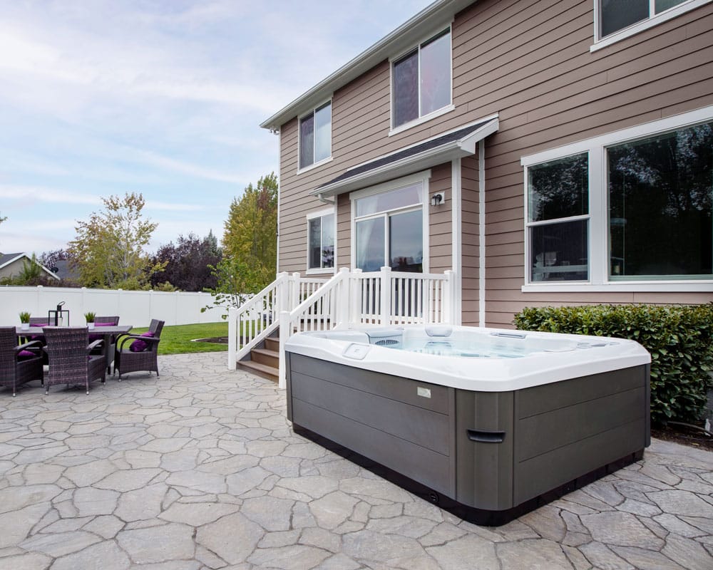 A Bullfrog Spa from the X Series, showcasing its contemporary design and functionality in a beautiful home
